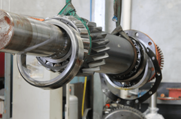 Gearbox mounted on test stand; run-in and vibration analysis underway.