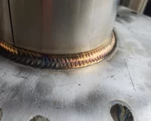 TIG-welded 304 bracket after radius edging and surface prep.